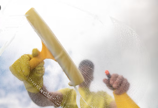 Routine seasonal window cleaning service in progress by Neon Clean team"